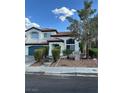 Beautiful two-story home featuring a tile roof, manicured landscaping, and a spacious two-car garage, offering great curb appeal at 1511 Balsam Mist Ave, Las Vegas, NV 89183