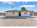Charming single-story house with a well-maintained gravel front yard and black security door at 2481 San Marcos St, Las Vegas, NV 89115