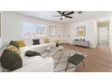 Bright living room features an open floorplan, neutral tones, and hardwood floors at 2481 San Marcos St, Las Vegas, NV 89115