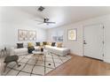 Bright living room showcasing modern decor, hardwood floors, and a ceiling fan at 2481 San Marcos St, Las Vegas, NV 89115