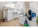 Bright kitchen featuring white cabinets, modern appliances, and ample counter space at 2643 Red Rock St # 201, Las Vegas, NV 89146
