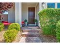 Inviting front entrance with brick walkway and manicured landscaping at 3531 Montepulciano Ln, Henderson, NV 89044