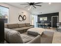 Open living room featuring a comfortable seating area and modern decor at 3531 Montepulciano Ln, Henderson, NV 89044
