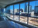 Expansive windows offer panoramic city views from this modern space with sleek, reflective floors and bright natural light at 4525 Dean Martin Dr # 1507, Las Vegas, NV 89103