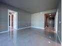 Bright living room boasts tile flooring and neutral paint, offering a modern and clean aesthetic at 4525 Dean Martin Dr # 1507, Las Vegas, NV 89103