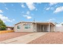 Charming single-story home with a covered parking area and low-maintenance landscaping at 49 Constitution Ave, Henderson, NV 89015