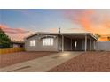 Charming single-story home with a covered parking area and low-maintenance landscaping at 49 Constitution Ave, Henderson, NV 89015