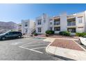 Condo building boasts well-kept grounds, stucco walls, and tile roof at 6800 E Lake Mead Blvd # 1034, Las Vegas, NV 89156