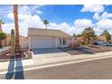 Inviting single-story home featuring well-maintained desert landscaping and a two-car garage at 765 Butternut Ct, Henderson, NV 89014