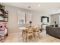 Cozy dining area with a charming table set and a view of the backyard at 7761 Sagamore Bay Ct, Las Vegas, NV 89179