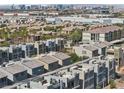 Scenic aerial view of the community showcasing modern home architecture and distant city skyline at 8042 Misty Canyon Ave, Las Vegas, NV 89113