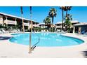 Resort-style pool with plenty of seating for residents to enjoy in the warm weather at 8410 Eldora Ave # 2046, Las Vegas, NV 89117