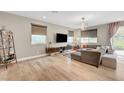 Bright living room featuring hardwood floors, modern lighting, and a large sectional sofa at , Las Vegas, NV 89139