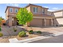 Charming two-story home features a two-car garage and a well-manicured front yard at 10101 Heron Lake Ave, Las Vegas, NV 89178