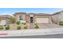 Charming single-story home featuring a tile roof, desert landscaping, and a two-car garage at 10601 Skye Arroyo Ave, Las Vegas, NV 89166