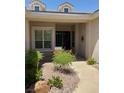 Inviting home entrance with manicured landscaping and charming curb appeal at 10816 Elm Ridge Ave, Las Vegas, NV 89144