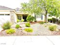 Charming single-story home with a well-maintained front yard and rock landscaping at 10816 Elm Ridge Ave, Las Vegas, NV 89144