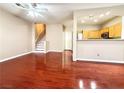 Bright living room with hardwood floors and an open floor plan to the kitchen at 1201 Dusty Creek St, Las Vegas, NV 89128