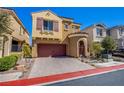 Beautiful exterior shot of a two-story home with a red tiled roof, two-car garage, and lush greenery at 1794 Morro Vista Dr, Las Vegas, NV 89135