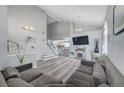 Inviting living room featuring vaulted ceilings, hardwood floors, fireplace, and comfortable seating at 1809 Solana Del Norte Way, North Las Vegas, NV 89031