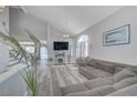 Bright living room featuring vaulted ceilings, hardwood floors, fireplace, and comfortable seating at 1809 Solana Del Norte Way, North Las Vegas, NV 89031
