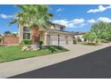 Beautiful two-story home with a three-car garage, lawn, and drought tolerant landscaping at 2382 Sunburst View St, Henderson, NV 89052
