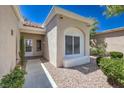 Inviting front entry with rock landscaping and tiled roof and trim at 2509 Banora Point Dr, Las Vegas, NV 89134