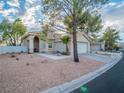 Well maintained one-story home with manicured gravel yard, sidewalk and two car garage at 2521 Seascape Dr, Las Vegas, NV 89128
