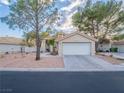 Lovely single-story home with low maintenance front yard and two-car garage at 2521 Seascape Dr, Las Vegas, NV 89128