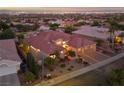 Aerial view of a beautiful home with lush landscaping and a red tile roof at 2548 Faiss Dr, Las Vegas, NV 89134