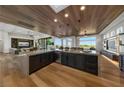 Open-concept kitchen with stainless steel appliances, island, and hardwood floors at 2548 Faiss Dr, Las Vegas, NV 89134
