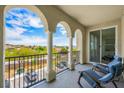 Charming balcony with seating and panoramic views of the surrounding neighborhood at 2555 Hampton Rd # 9307, Henderson, NV 89052