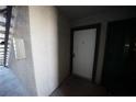 Hallway leading to unit, door and staircase at 2606 S Durango Dr # 165, Las Vegas, NV 89117