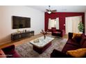 A stylish living room features designer furnishings, a plush rug, and a sleek entertainment center for modern comfort at 2787 Sunken Ship St, Laughlin, NV 89029