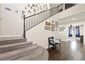 Grand entryway featuring a staircase and hardwood floors at 335 Pleasant Summit Dr, Henderson, NV 89012