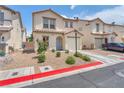 Charming two-story home showcasing a desert landscape, attached garage, and welcoming front entrance at 4252 Olympic Point Dr, Las Vegas, NV 89129