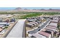 Aerial view of a residential area in the desert, showcasing neighborhood layout and surrounding landscape at 440 Blue Lark Dr, Henderson, NV 89011