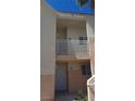 Two-story condo building featuring neutral stucco exterior and gated entry at 5000 Red Rock St # 248, Las Vegas, NV 89118