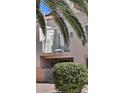 Condo building featuring balcony and mature landscaping at 5000 Red Rock St # 248, Las Vegas, NV 89118