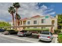 Condo exterior showcasing covered parking, lush landscaping, and architectural details with desert landscaping at 5000 Red Rock St # 248, Las Vegas, NV 89118