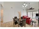Bright living room with dining table and tile flooring, with sliding doors to outside patio at 5000 Red Rock St # 248, Las Vegas, NV 89118