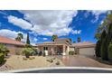 Charming single-story home boasting a tile roof, desert landscaping, and an attached garage at 5416 Alabaster Ct, Las Vegas, NV 89149