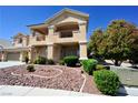 Beautiful two-story home with a charming balcony, well-maintained landscaping, and a welcoming facade at 5808 Amber Station Ave, Las Vegas, NV 89131