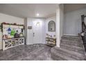 Inviting foyer with tile flooring, stairs, and decorative accents creating a warm entry at 689 Sea Star St, Henderson, NV 89002