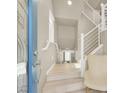 Bright entryway with a staircase and a modern chair at 8060 Haywood Estate Ave, Las Vegas, NV 89113
