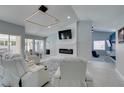 Living room showcases a fireplace and ample natural light, creating a welcoming space at 8150 Beaverbrook Way, Las Vegas, NV 89123