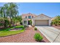 Charming home boasts mature trees, landscaping, and a spacious two-car garage at 9817 Dardanelle Ct, Las Vegas, NV 89117