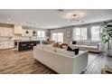 Open floor plan with living room, kitchen and dining area creating a bright and inviting space at 9870 Fisher Bay Ct, Las Vegas, NV 89178