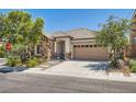 Well-maintained single story home featuring stone accents and a spacious two-car garage at 10121 Iron Wood Peak Ave, Las Vegas, NV 89166