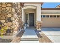 Inviting entryway with stone accents and decorative touches at 10121 Iron Wood Peak Ave, Las Vegas, NV 89166